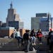Students from Cloquet High School take in the view of downtown St. Paul while taking a break during the Native American College Fair at the Minnesota 