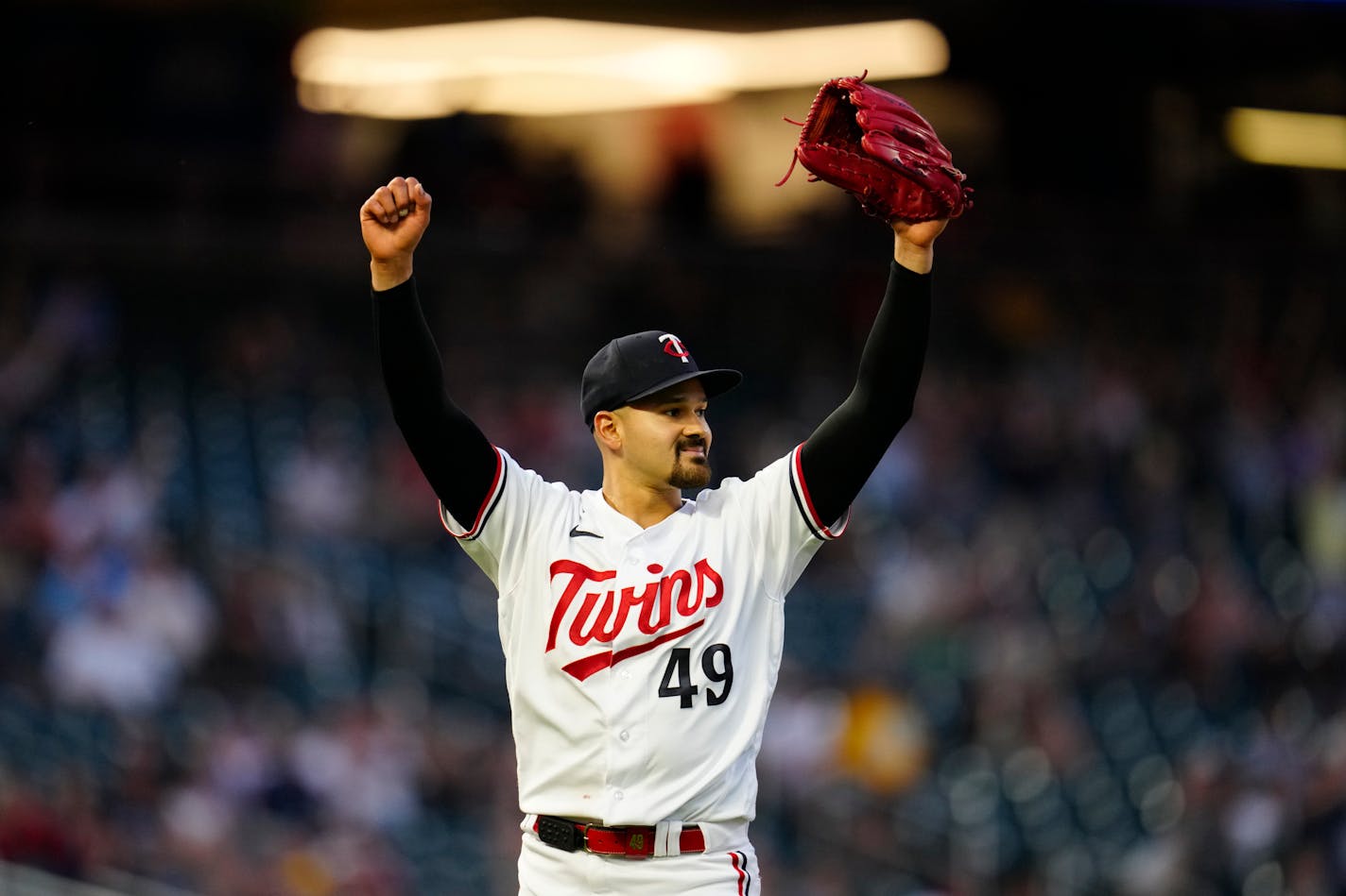 Minnesota Twins starting pitcher Pablo Lopez (49) celebrates after a diving catch by right fielder Max Kepler to end the top of the eighth inning of a baseball game against the Kansas City Royals, Wednesday, July 5, 2023, in Minneapolis. (AP Photo/Abbie Parr)