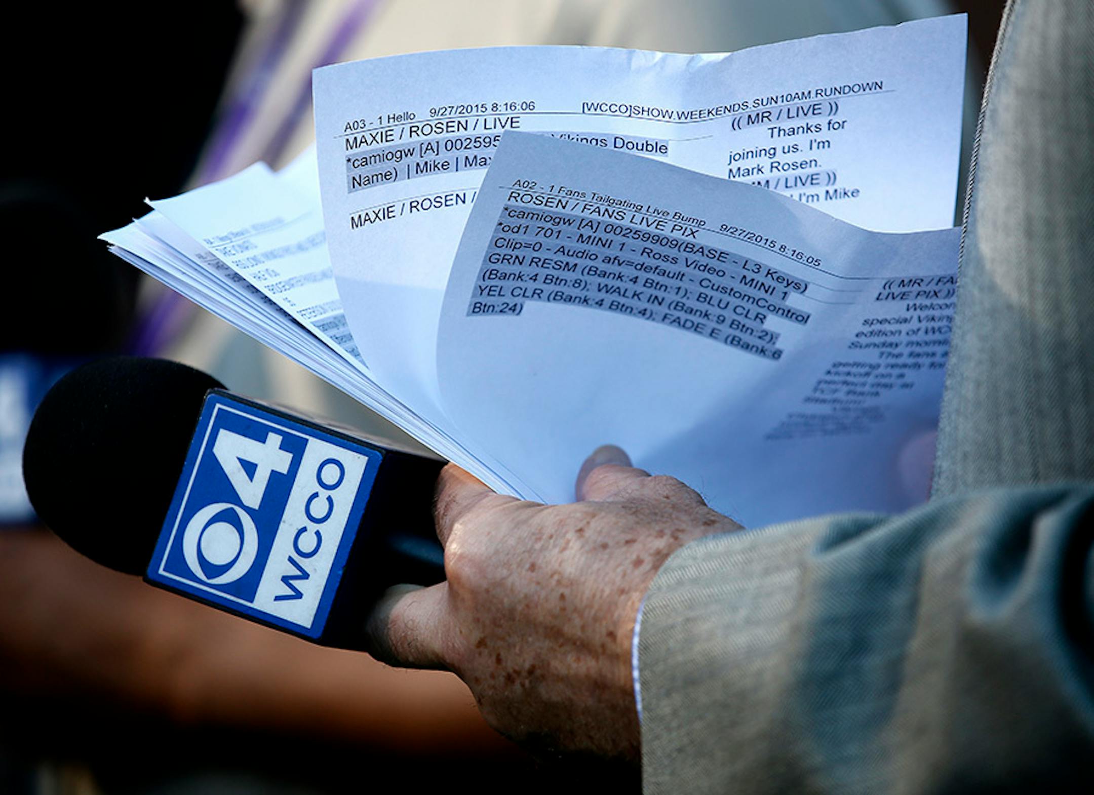 WCCO sports director Mark Rosen looked through his script as he prepared for a pregame broadcast from the sidelines of TCF Bank Stadium before the Vikings vs. Lions game.