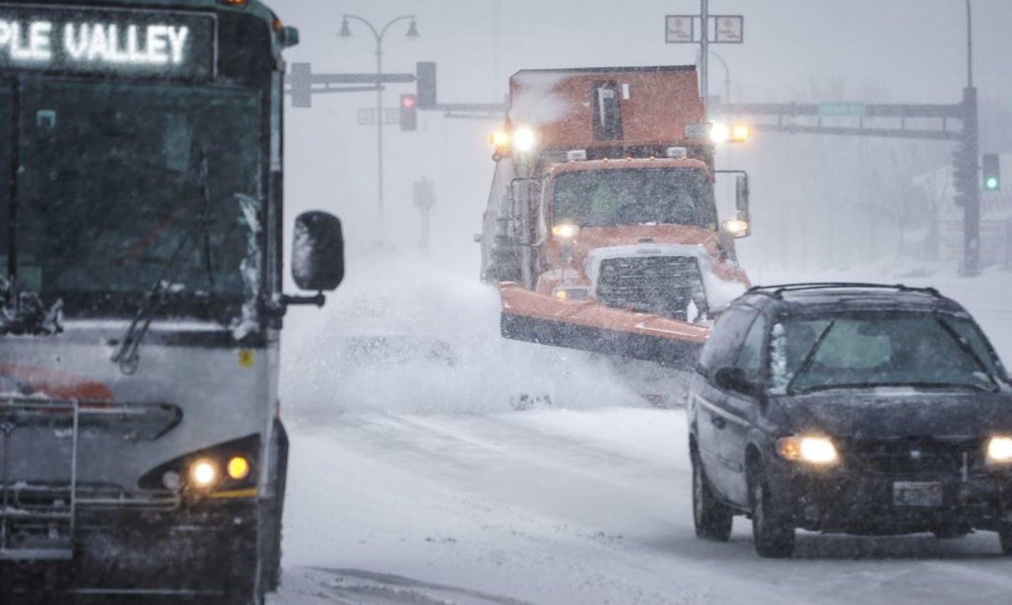 Plows cleared the roads in Apple Valley Monday evening.