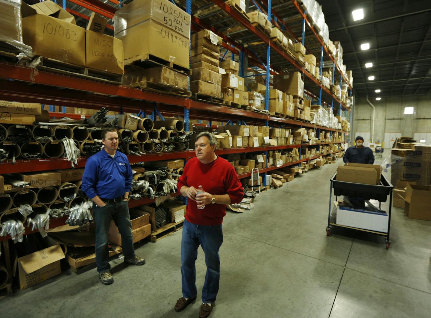 Clam Outdoors is the largest maker of portable ice fishing shelters. Dave Osborne, right, owner of Clam Outdoors, and Nick Chiodo, director of marketing, stood among products in Clam&#x2019;s massive headquarters in Rogers.