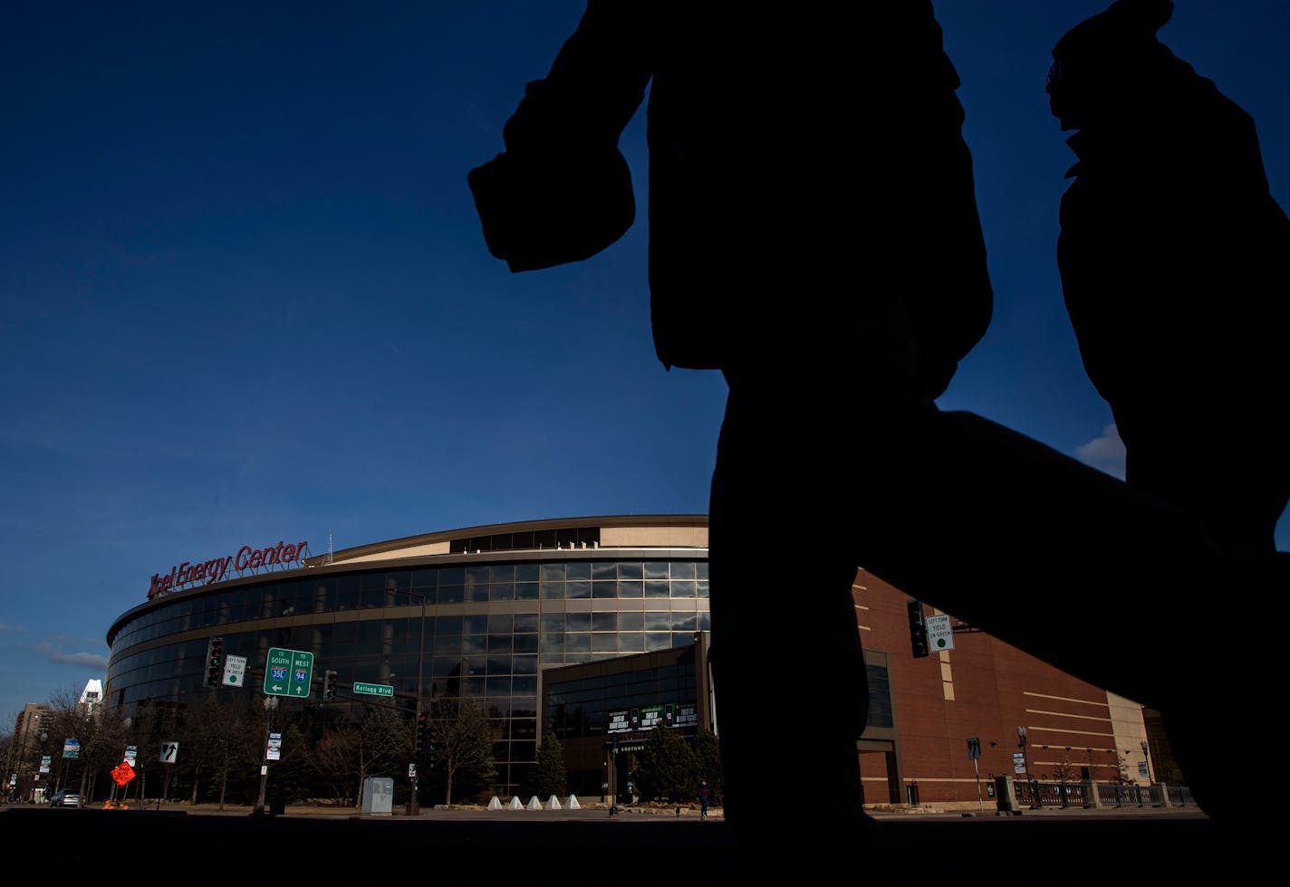 Pedestrians crossed the street in front of the Xcel Energy Center in May, where the Minnesota Wild were scheduled to have a home game before the NHL paused the season.