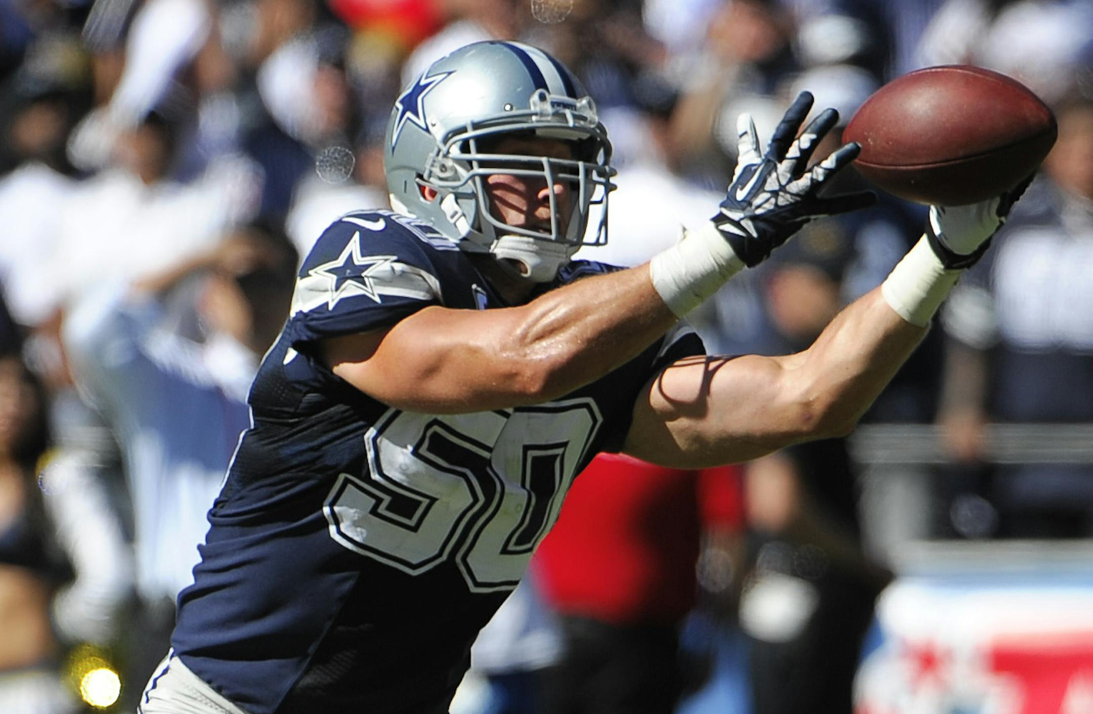 Dallas Cowboys middle linebacker Sean Lee intercepts a pass for a touchdown against the San Diego Chargers during the first half of an NFL football game Sunday, Sept. 29, 2013, in San Diego. (AP Photo/Denis Poroy) ORG XMIT: NYOTK