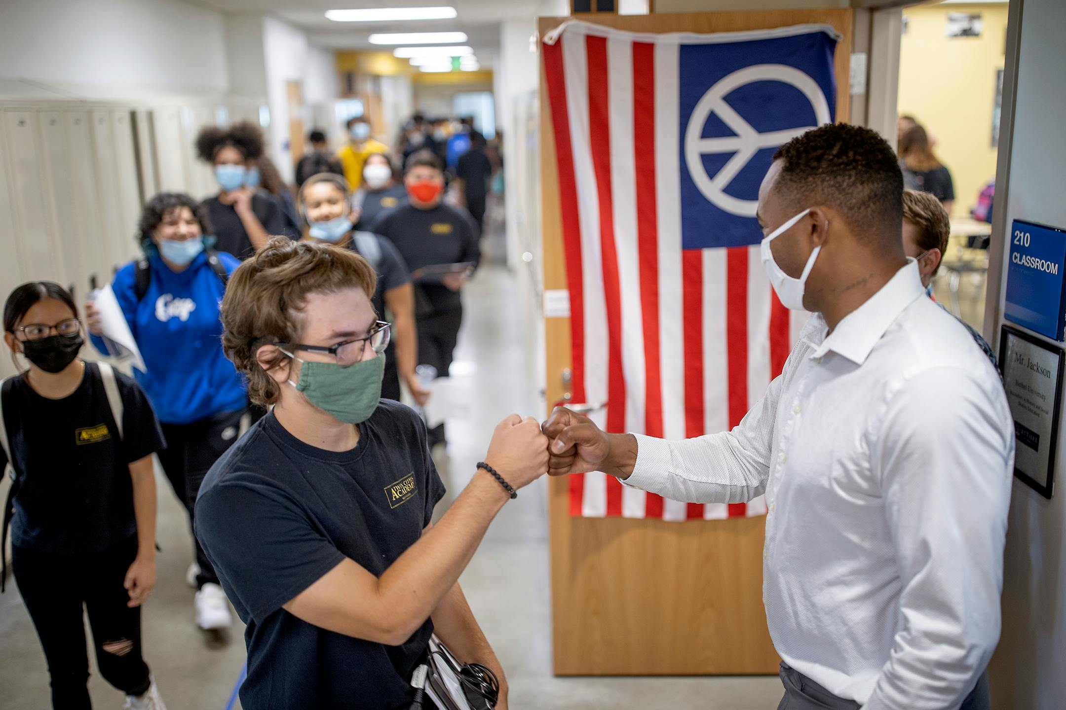 Twin Cities Academy charter school Special Education Para-professional Torrean Shaw greeted students as they made their way to their classes on the first day of school, Tuesday, September 7, 2021 in St. Paul, MN.    ]  ELIZABETH FLORES • liz.flores@startribune.com