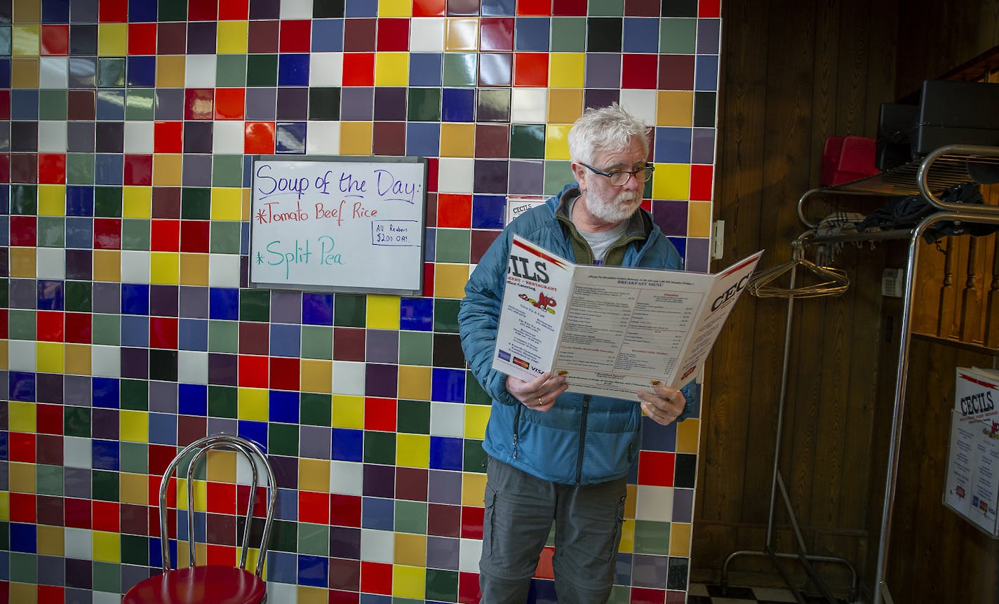 Cecil's Deli customer Angus McKechnie, cq, looked over the menu to make a take-out order, Tuesday, February 12, 2019 in St. Paul, MN. The Deli was established in 1949. ] ELIZABETH FLORES &#x2022; liz.flores@startribune.com