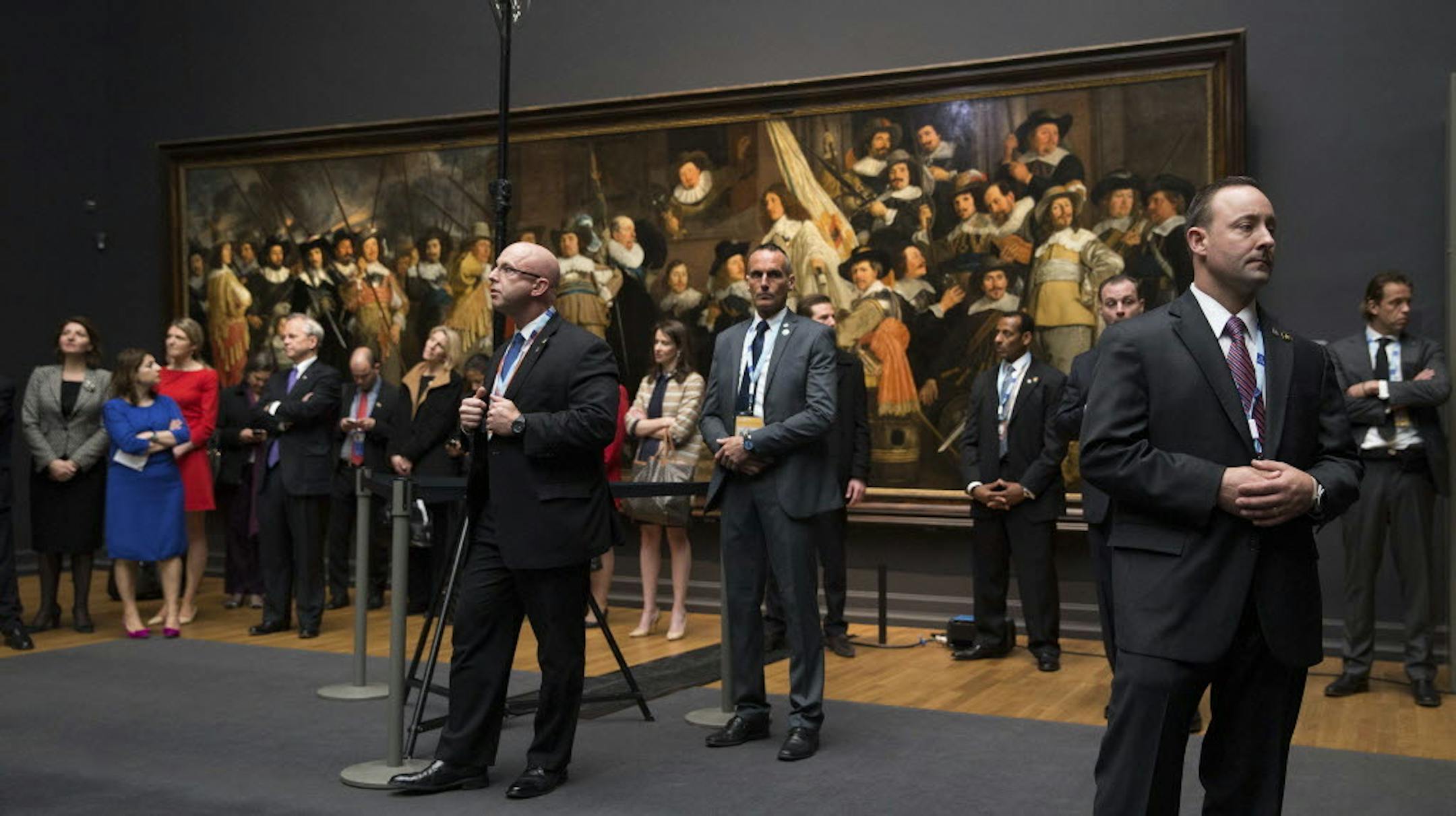 Members of the Secret Service stand guard as President Barack Obama and Dutch Prime Minister Mark Rutte speak at the Rijksmuseum in Amsterdam, March 24, 2014.