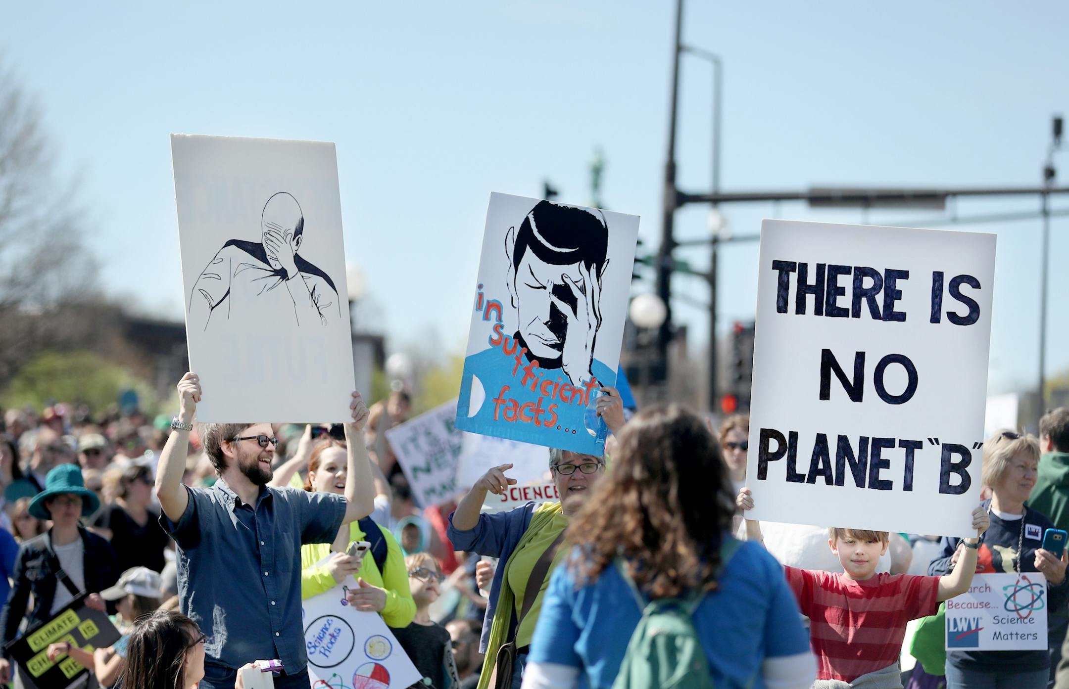 March for Science moved from the start at Cathedral Hill Park to State Capitol, with an estimated 10,000 or more joining to champion the role of science in American life. Here, Ben Zibble, left, of St. Paul, joined others with Star Trek themed signs during the March for Science near Cathedral Hill Park Saturday, April 22, 2017, in St. Paul, MN.