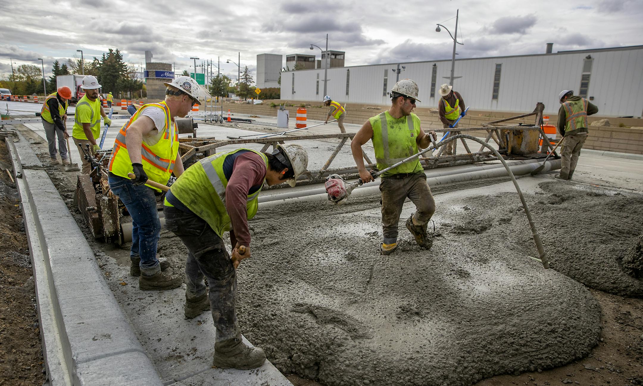 Workers worked along Glumack Drive, likely one of the busiest thoroughfares in the state, Monday, September 28, 2020 in Bloomington, MN. The quarter-mile roadway feeds into the Minneapolis-St. Paul International Airport and was in dire need of repair. Now, through an odd quirk of fate -- the global pandemic -- the road is being overhauled with minimual disruption because air travel has plunged and workers can proceed with the project largely unimpeded. ] ELIZABETH FLORES • liz.flores@startribune