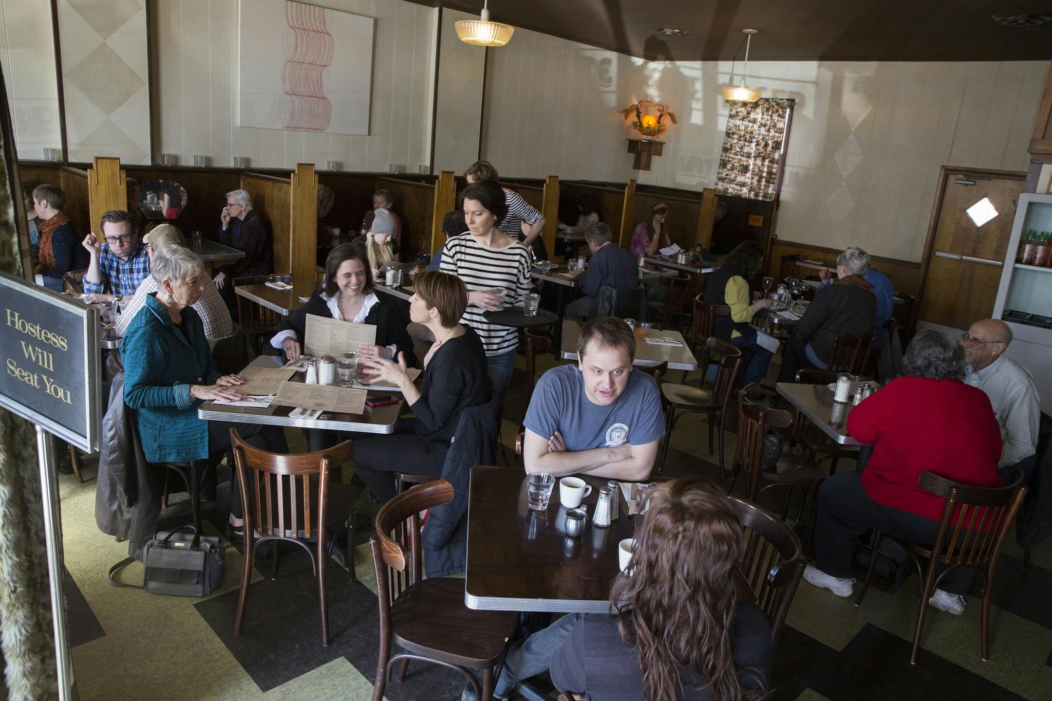 Customers eat lunch at the Modern Cafe in Minneapolis on Tuesday, March 10, 2015.