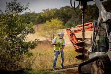 A construction crew worked Monday on the new Battle Creek Winter Recreation area at Battle Creek Regional Park in St. Paul.