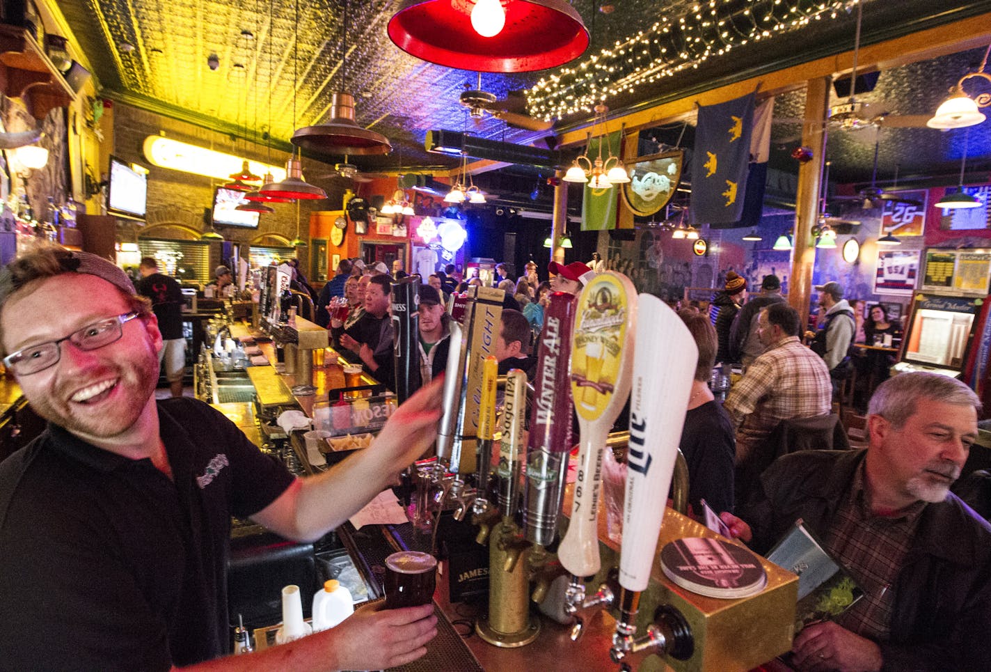 Bartender George Huss happily serves customers at Shamrock's in St. Paul January 17, 2015. (Courtney Perry/Special to the Star Tribune)