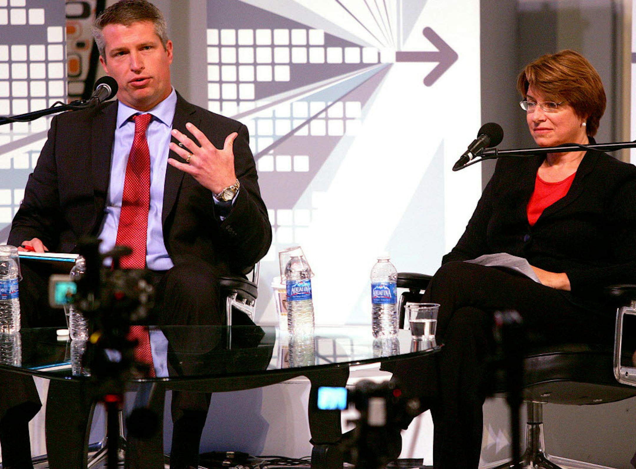 Minnesota state Rep. Kurt Bills, left, gestures while Sen. Amy Klobuchar, D-Minn., listens during a recent U.S. Senate candidate forum in Duluth.