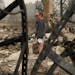 Desiree Pierce reacts as she visits her home destroyed by the Almeda Fire, Friday, Sept. 11, 2020, in Talent, Ore. "I just needed to see it, to get so