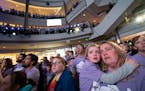Alizabeth Ludwig, 6, embraced her mother Carrie Ludwig, of Richmond, both with tears in their eyes, as they sang along to the song Clouds by Zach Zobi