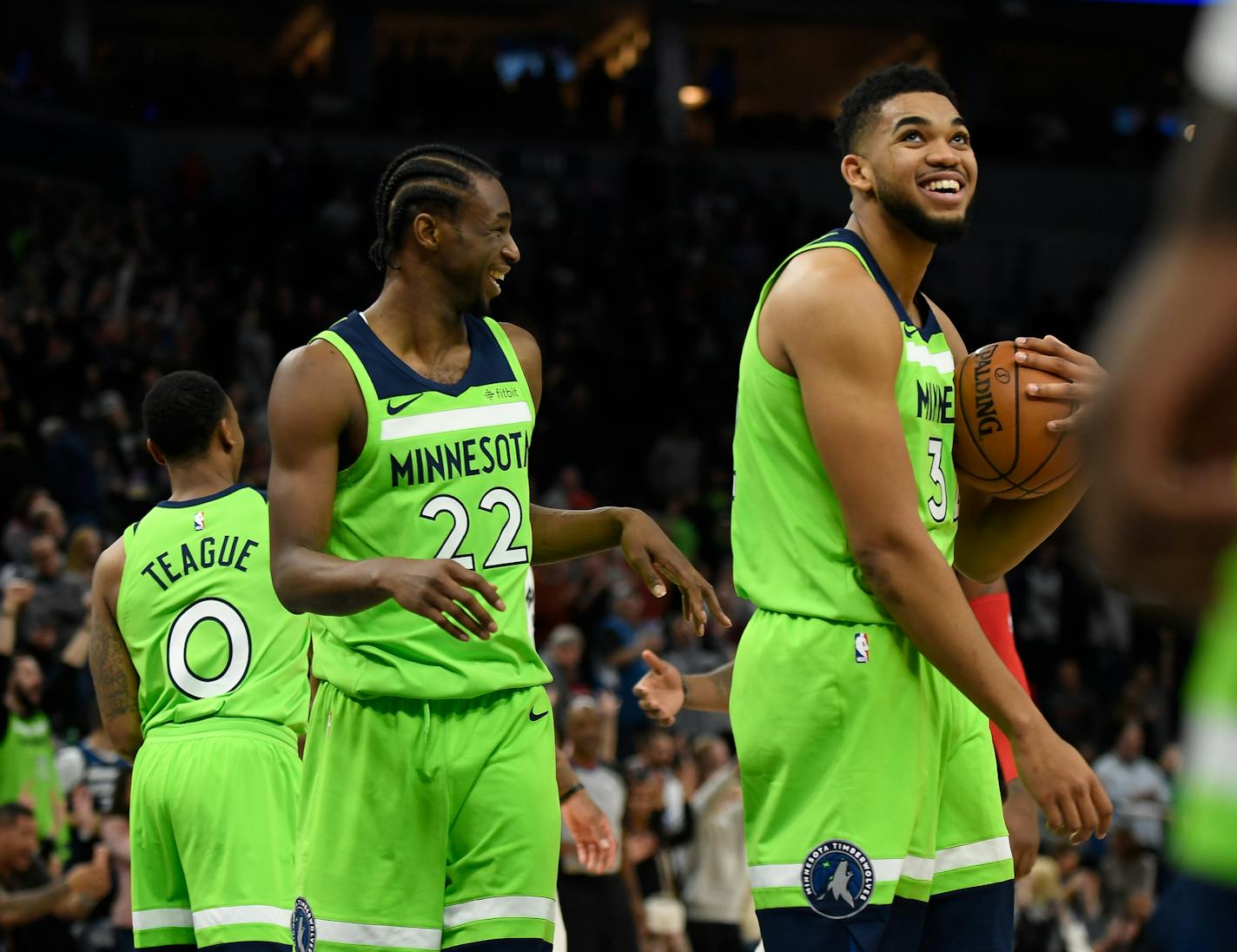 The Minnesota Timberwolves' Karl-Anthony Towns, right, and Andrew Wiggins (22) are all smiles following a 115-109 victory against the Toronto Raptors on Saturday, Jan. 20, 2018, at Target Center in Minneapolis. The Timberwolves won, 115-109. (Aaron Lavinsky/Minneapolis Star Tribune/TNS) ORG XMIT: 1221634