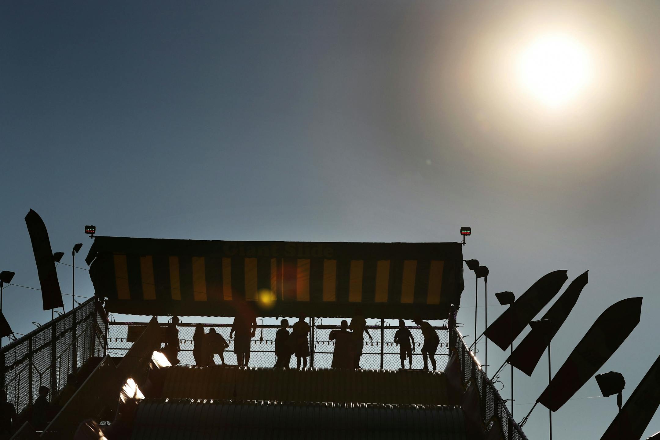 People prepare to head down the Giant Slide on the first day of the Minnesota State FairThursday, Aug. 25, 2016, in Falcon Heights, MN.