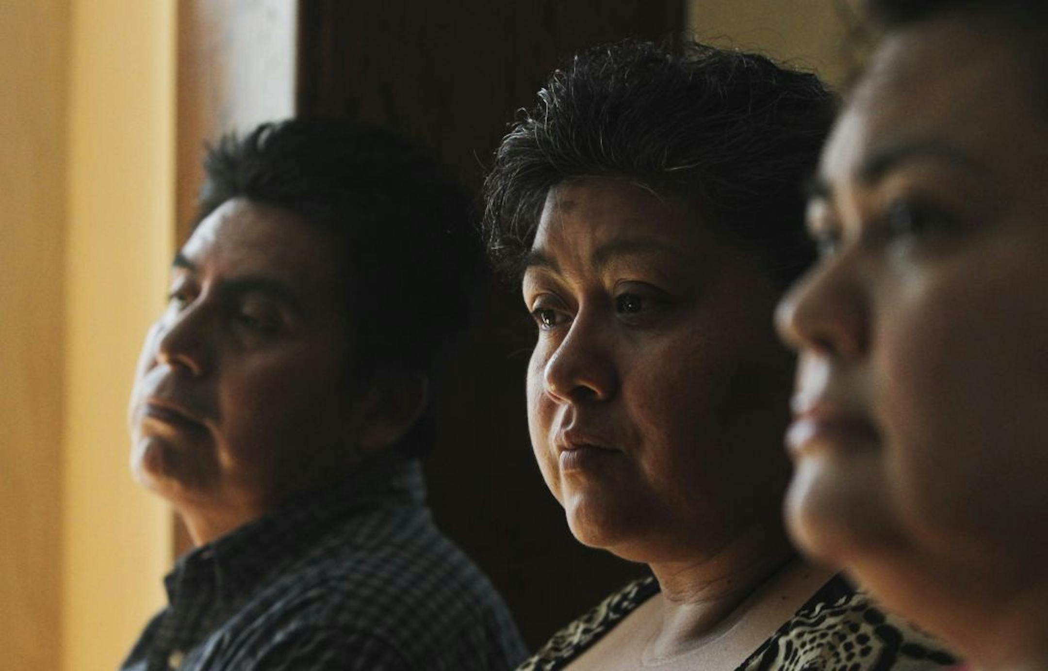 Zenaldo Rivera Garcia, left to right, his wife Gloria Nunez Guevara and her sister Veronica Nunez Guevara sat down at their South Minneapolis residence to talk about the money awards resulting from being victimized by the now disbanded Metro Gang Strike Force and were photographed in Minneapolis, MN, Thursday, Aug. 3, 2012.
