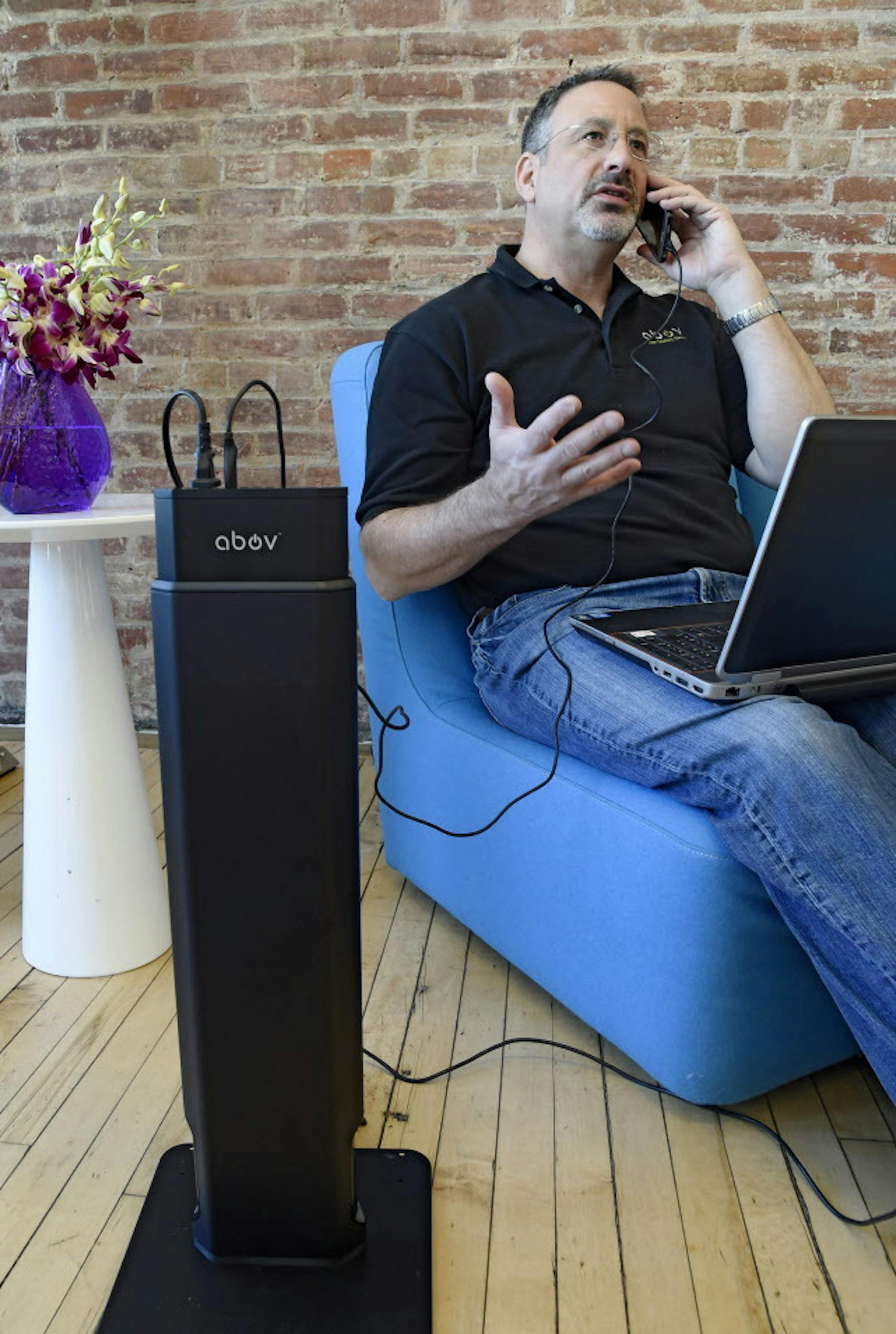 Dean Rosenblum, inventor of the Voltower, is all plugged into the Voltower, earth's first height-adjustable power strip tower. (Clem Murray/Philadelphia Inquirer/TNS) ORG XMIT: 1182334