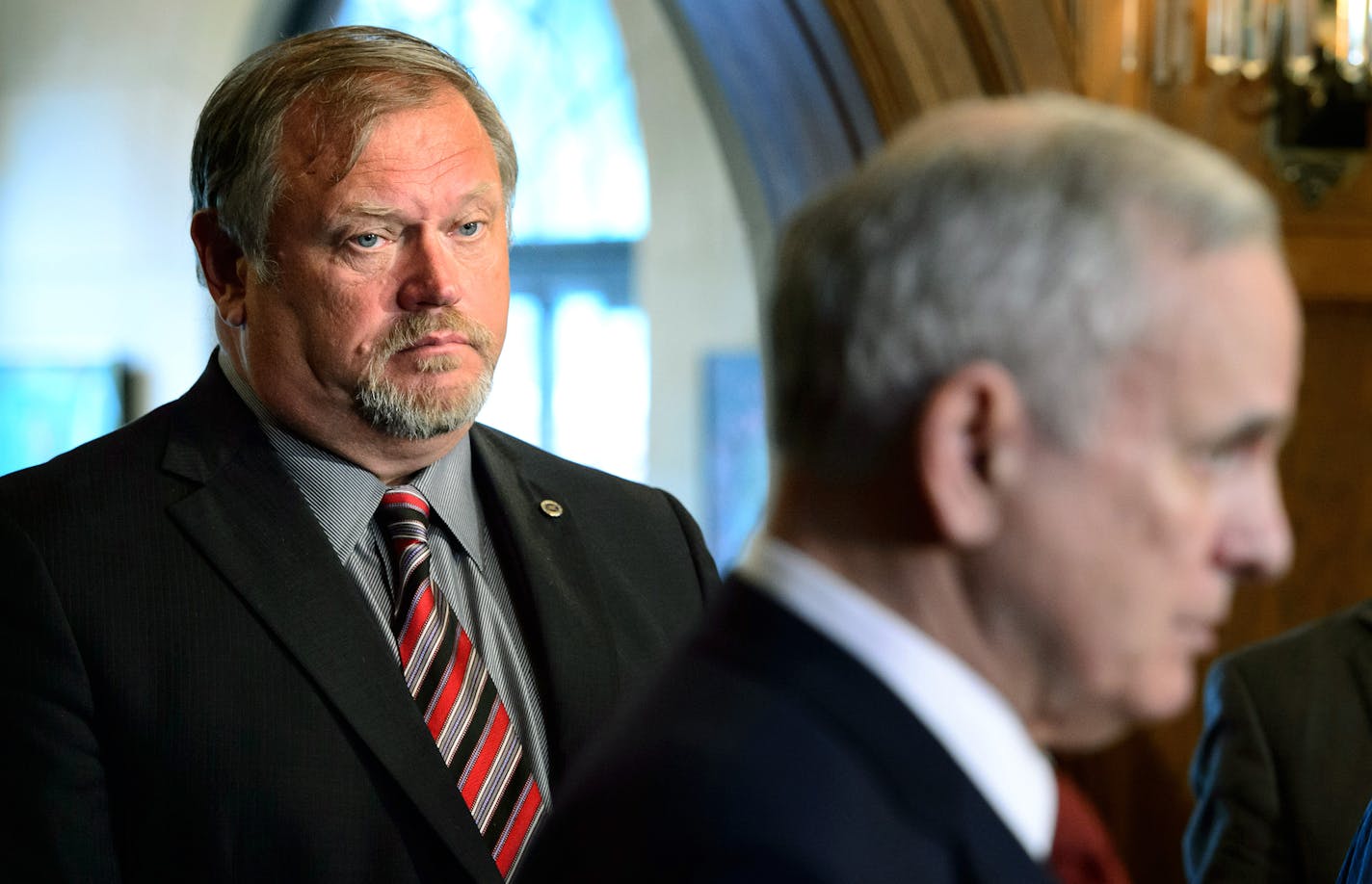 Senate Majority Leader Tom Bakk listened to Gov. Mark. Dayton talk about obstacles to finalizing a budget deal, Thursday, June 11, 2015, at the governor's residence, in St. Paul.