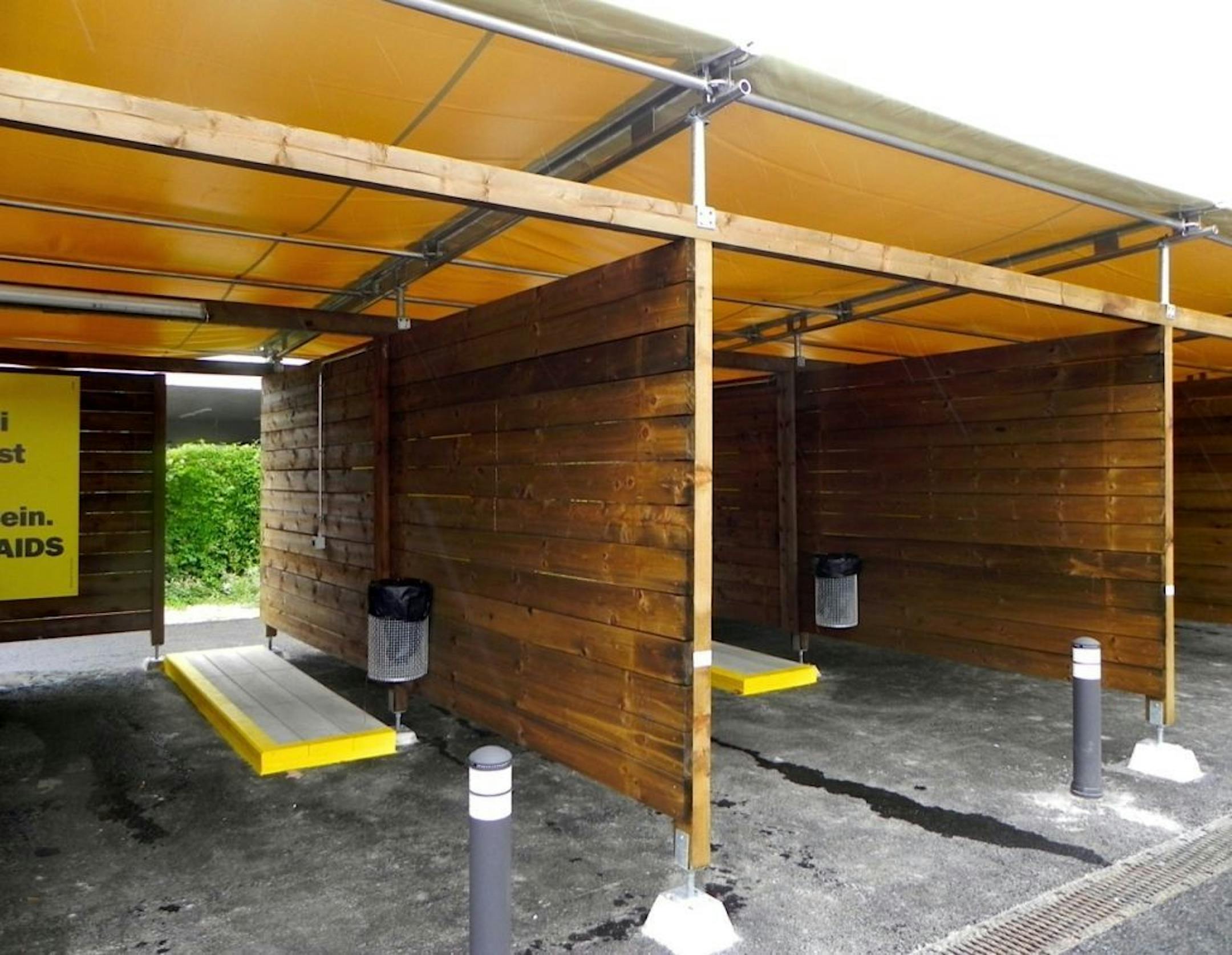 In this Saturday, Aug. 24, 2013 photo, a row of open wooden garage-style �sex boxes� are seen in Zurich, Switzerland.