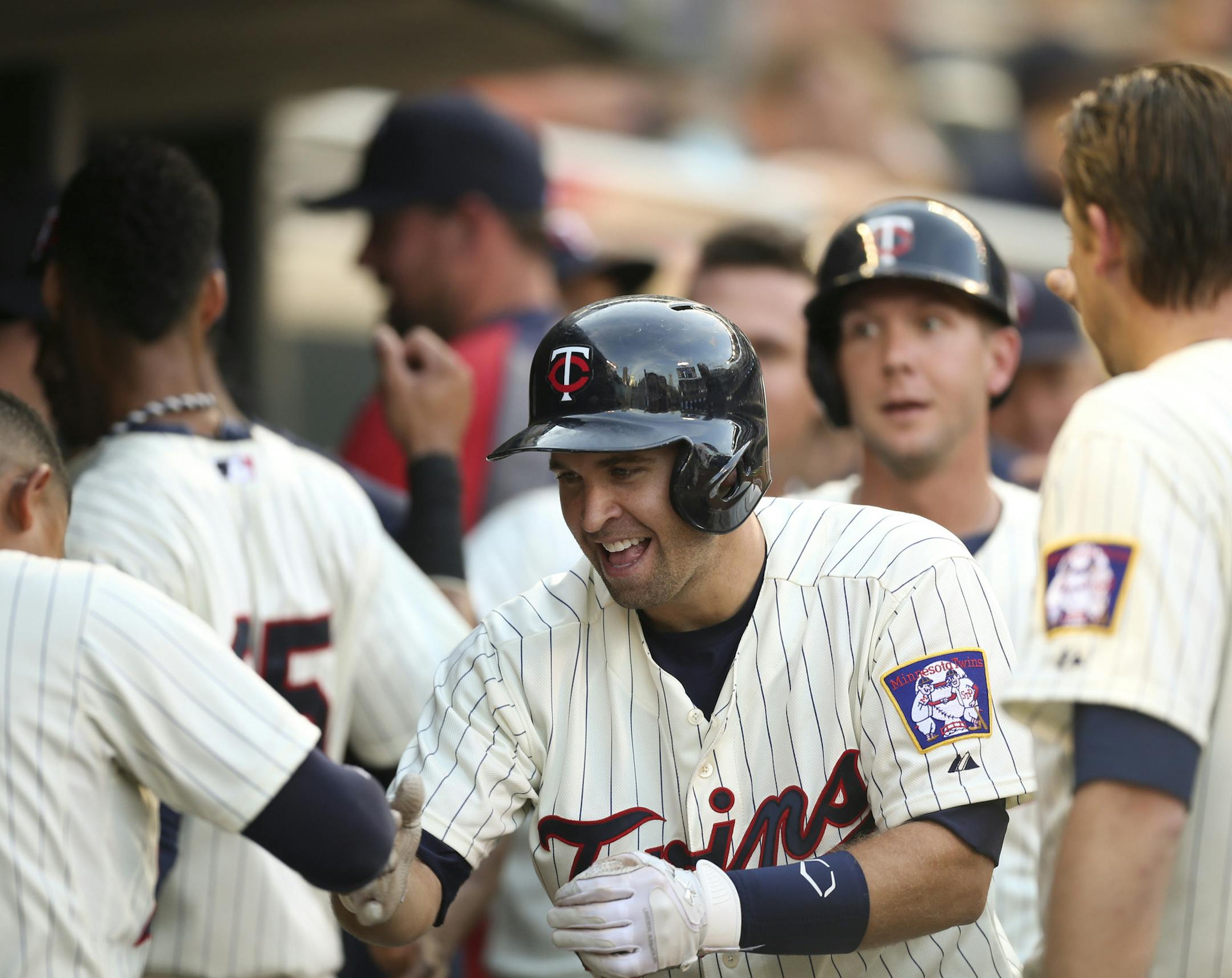 Brian Dozier, center, celebrated his second-inning, three-run homer in the Twins’ 7-4 victory over the White Sox on Wednesday night.