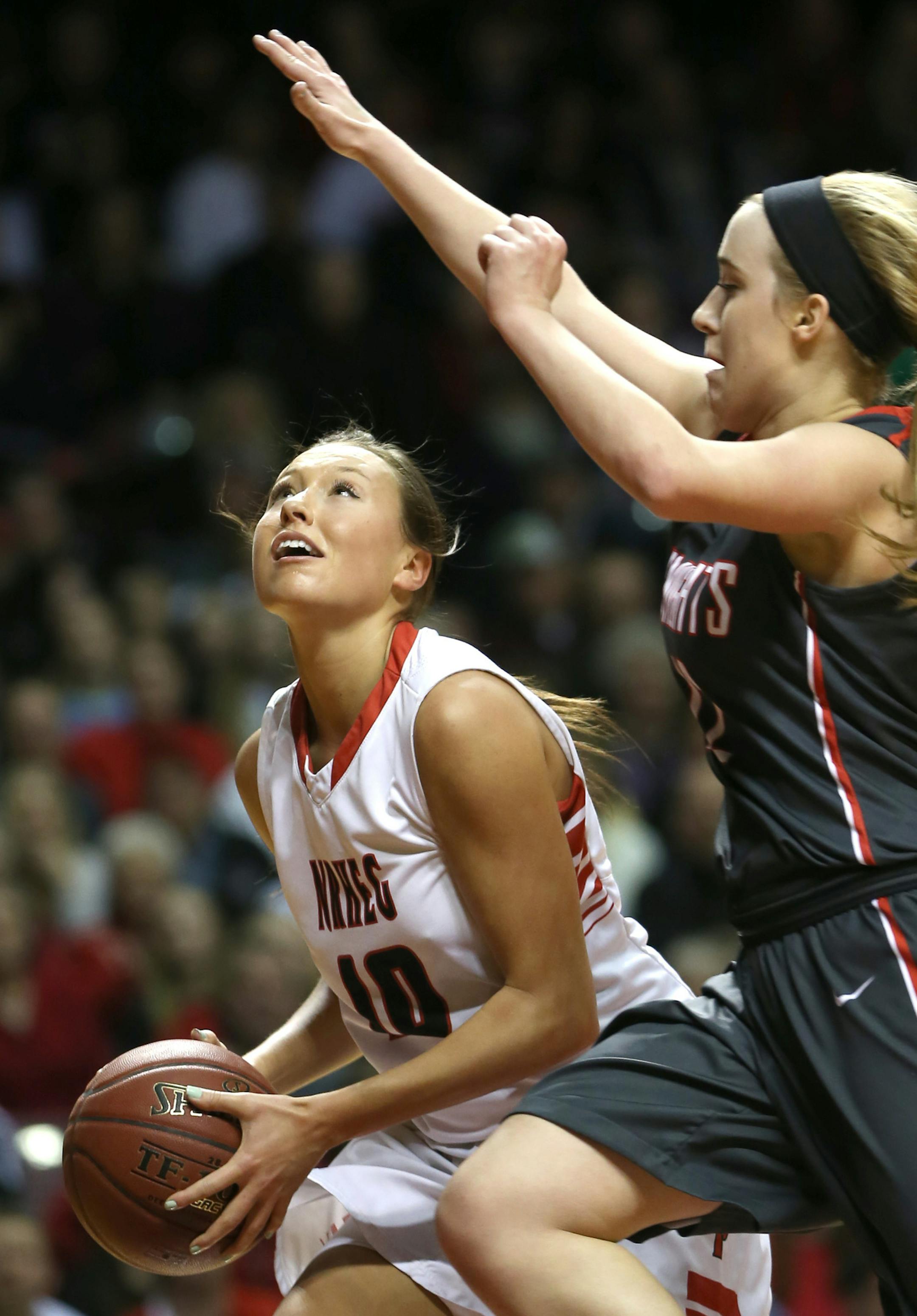 (left to right) NRHEG's Paige Overgaard looked to shoot on the Kenyon-Wanamingo defense.] Girls Basketball Tournament, 3/22/14, Willams Arena, Class 2A championship game, Kenyon-Wanamingo vs New Richland-H-E-G. Bruce Bisping/Star Tribune bbisping@startribune.com Paige Overgaard/roster.