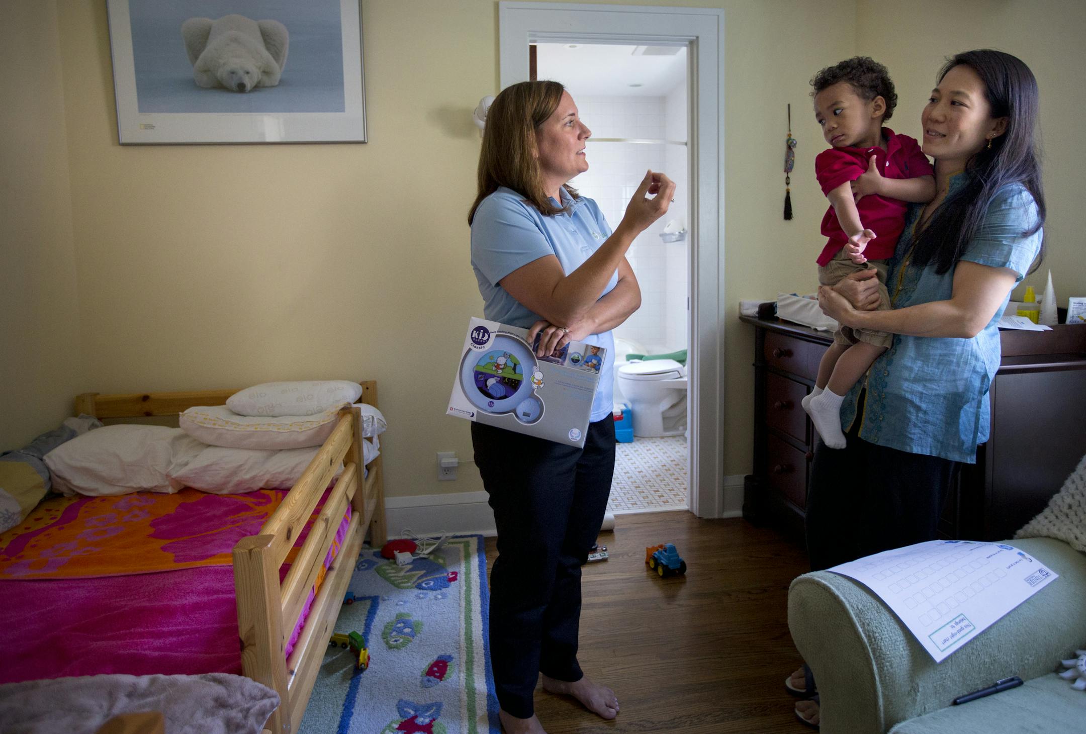 Sleep consultant Leann Latus meets with mother Marie Shau to assess her son Milo's sleep environment. This means surveying the bedroom and talking with the mother about bedtime routines. ] Brian.Peterson@startribune.com Minneapolis, MN - 7/13/2015
