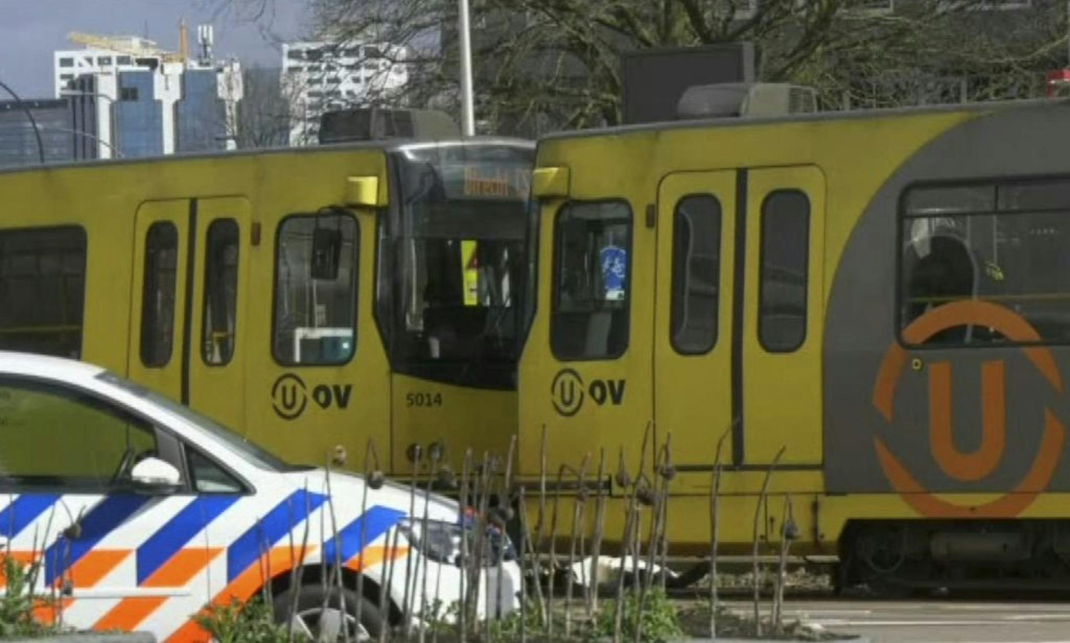In this image taken from video, a body lays next to a tram as emergency services attend the scene of a shooting in Utrecht, Netherlands, Monday March 18, 2019. Police in the central Dutch city of Utrecht say on Twitter that "multiple" people have been injured as a result of a shooting in a tram in a residential neighborhood.