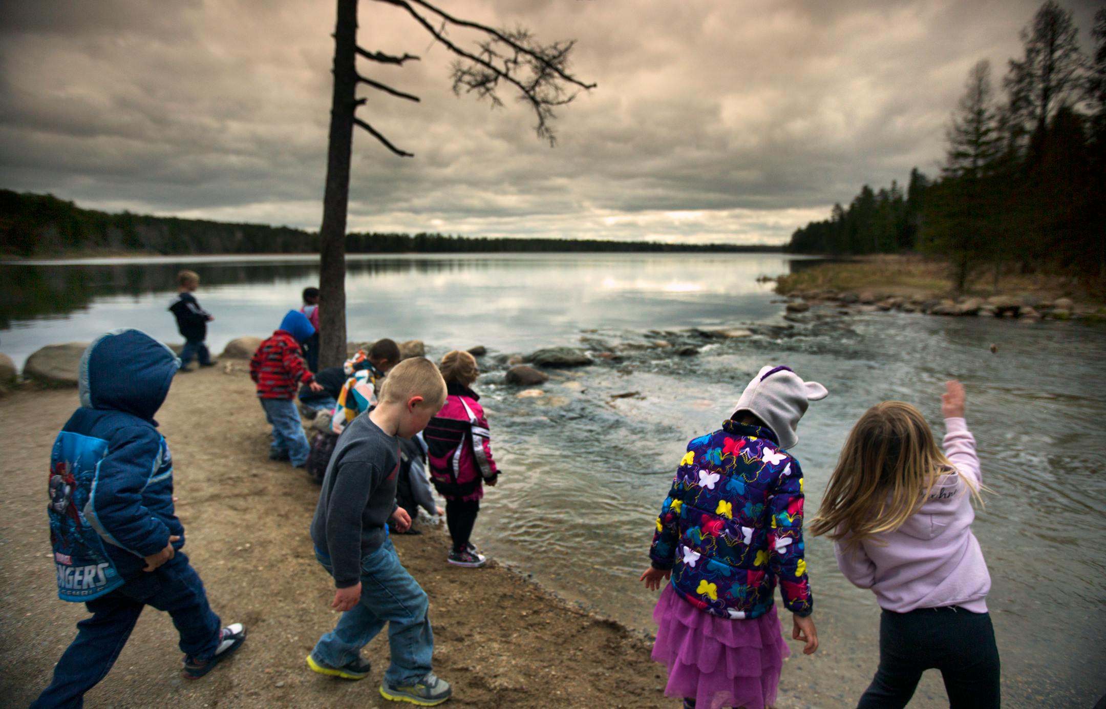 As water flows out of Lake Itasca in NW Minnesota, the Mississippi River begins a 2,552 mile journey to the Gulf of Mexico. The headwaters are one of Minnesota's most popular tourist attractions, Here, elementary school children enjoy a field trip to the national landmark.