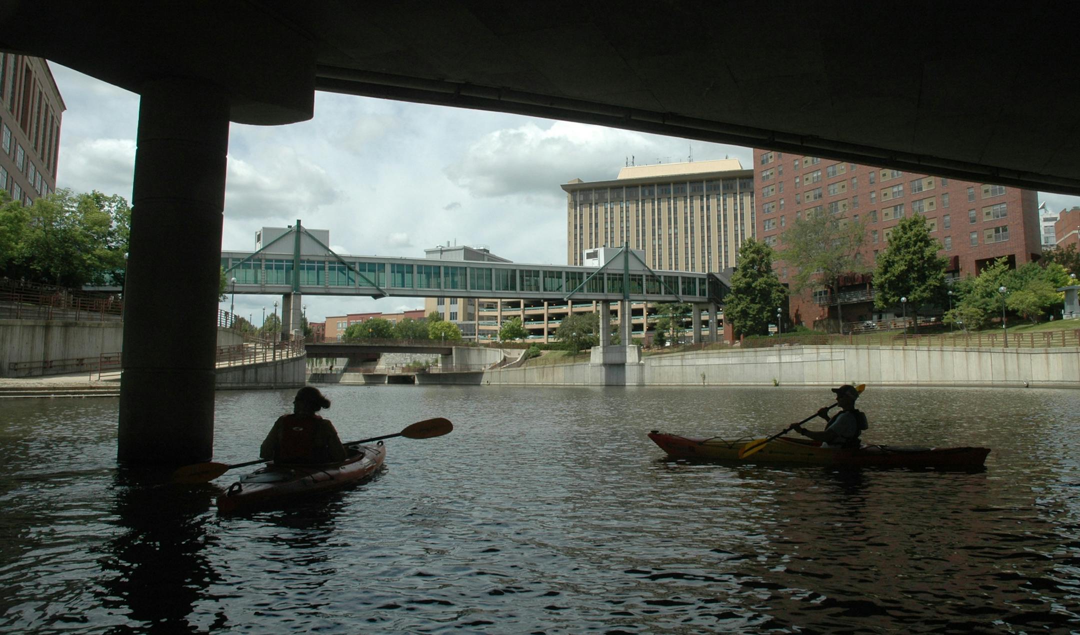 MPCA Watershed Monitoring Specialist Tiffany Schauls and Zumbro Watershed Partnership Chair Brett Ostby kayak the Zumbro River on Wednesday, June 29, 2016. A multi-billion-dollar redo of Rochester meant to secure its reputation as a global destination for health care and medicine has some calling for the beautification of the Zumbro, which for years has been walled off due to flood fears.