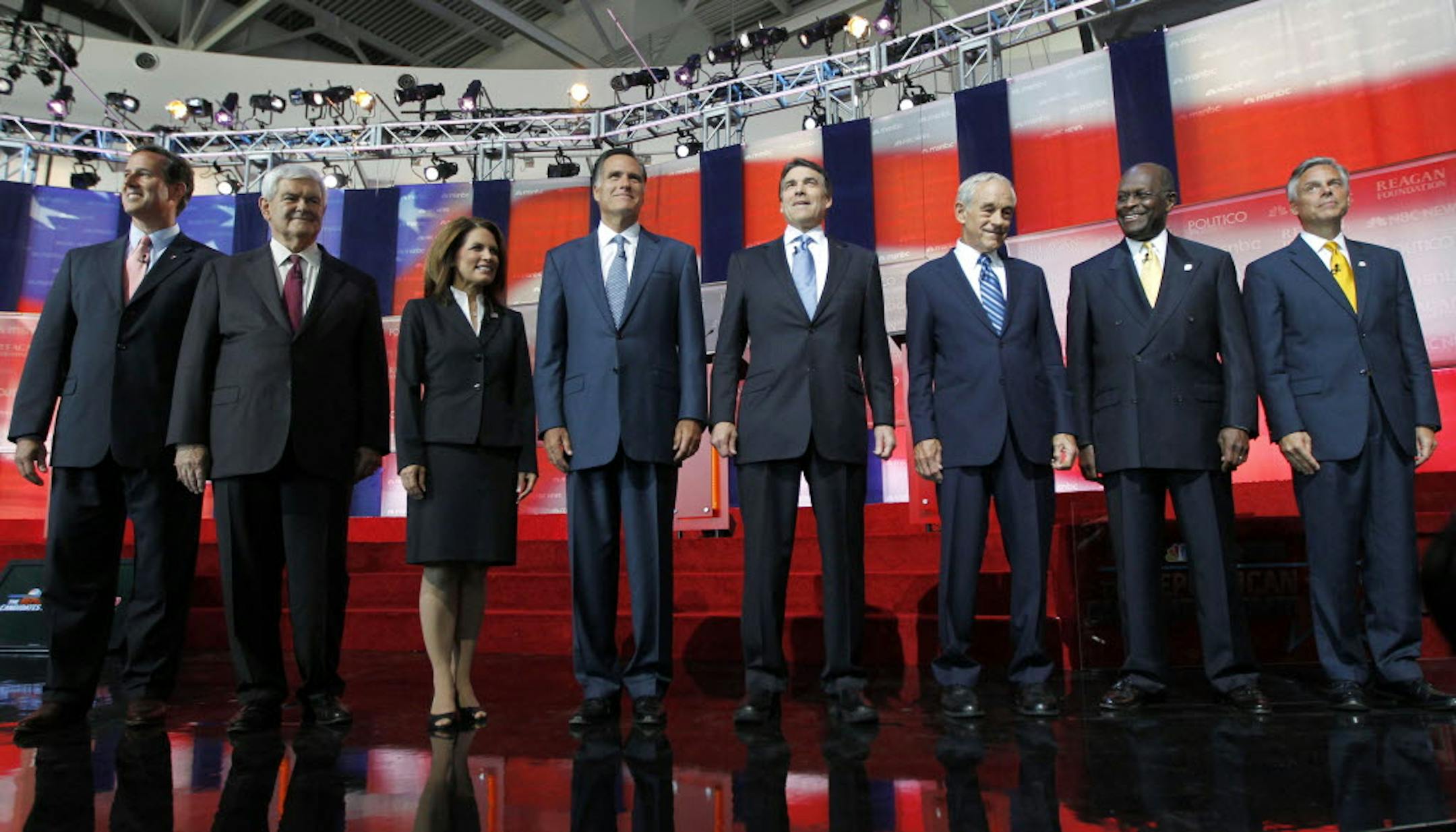 Republican presidential candidates, from left, former Pennsylvania Sen. Rick Santorum, former House Speaker Newt Gingrich, Rep. Michele Bachmann, R-Minn., former Massachusetts Gov. Mitt Romney, Texas Gov. Rick Perry, Rep. Ron Paul, R-Texas, businessman Herman Cain and former Utah Gov. Jon Huntsman stand together before Wednesday's Republican presidential candidate debate.