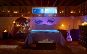 The photo featured in Airbnb's ad for the Purple Rain House shows a basement bedroom fashioned after the one seen in Prince's 1984 movie.