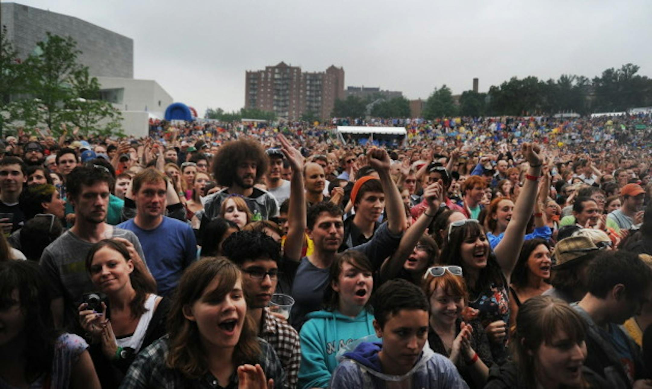 Last year's soggy Rock the Garden crowd outside Walker Art Center.
