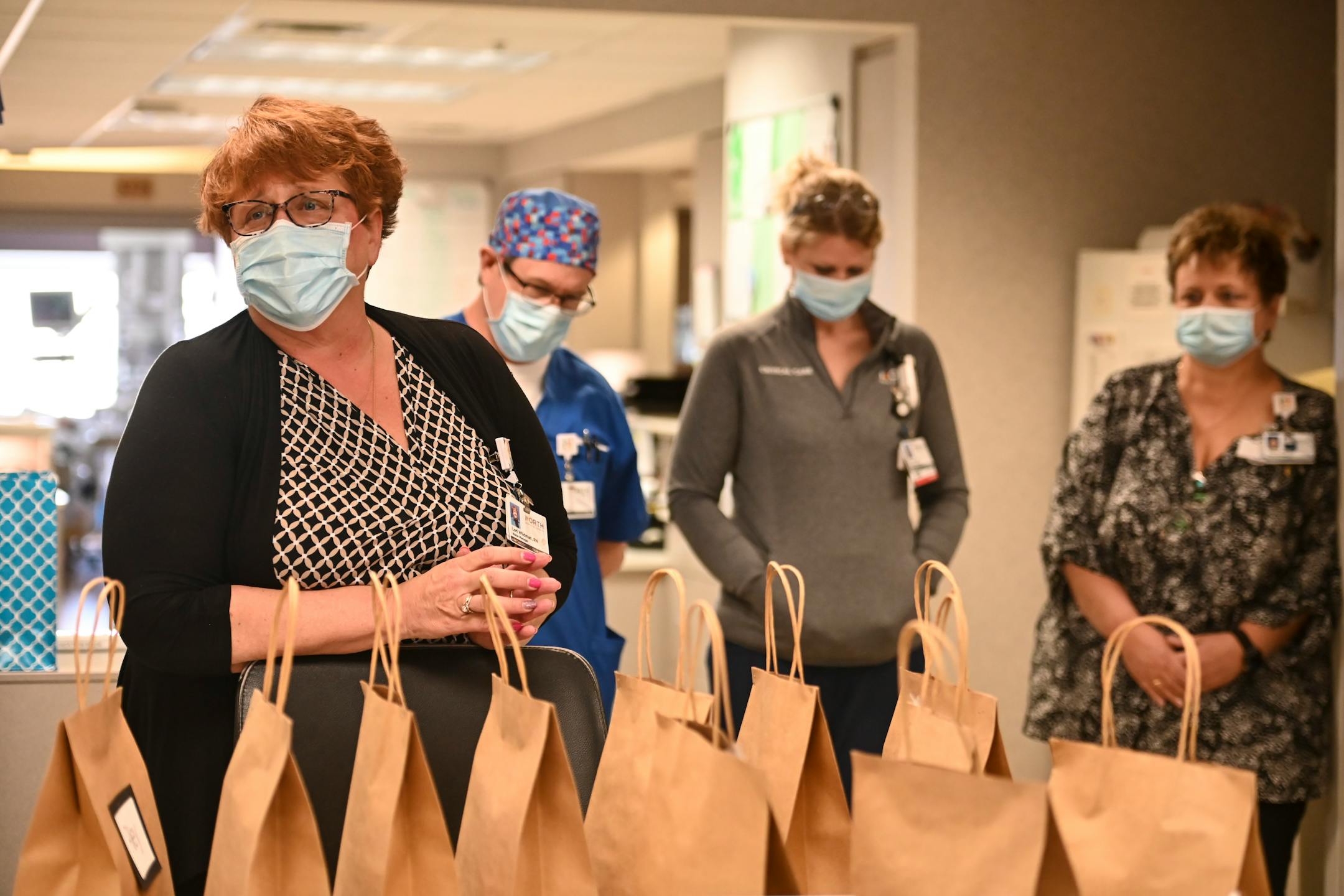 North Memorial South 7 ICU nurse manager Lori Wildman gave a speech to healthcare workers as they marked one year of COVID-19 within the unit walls Wednesday afternoon