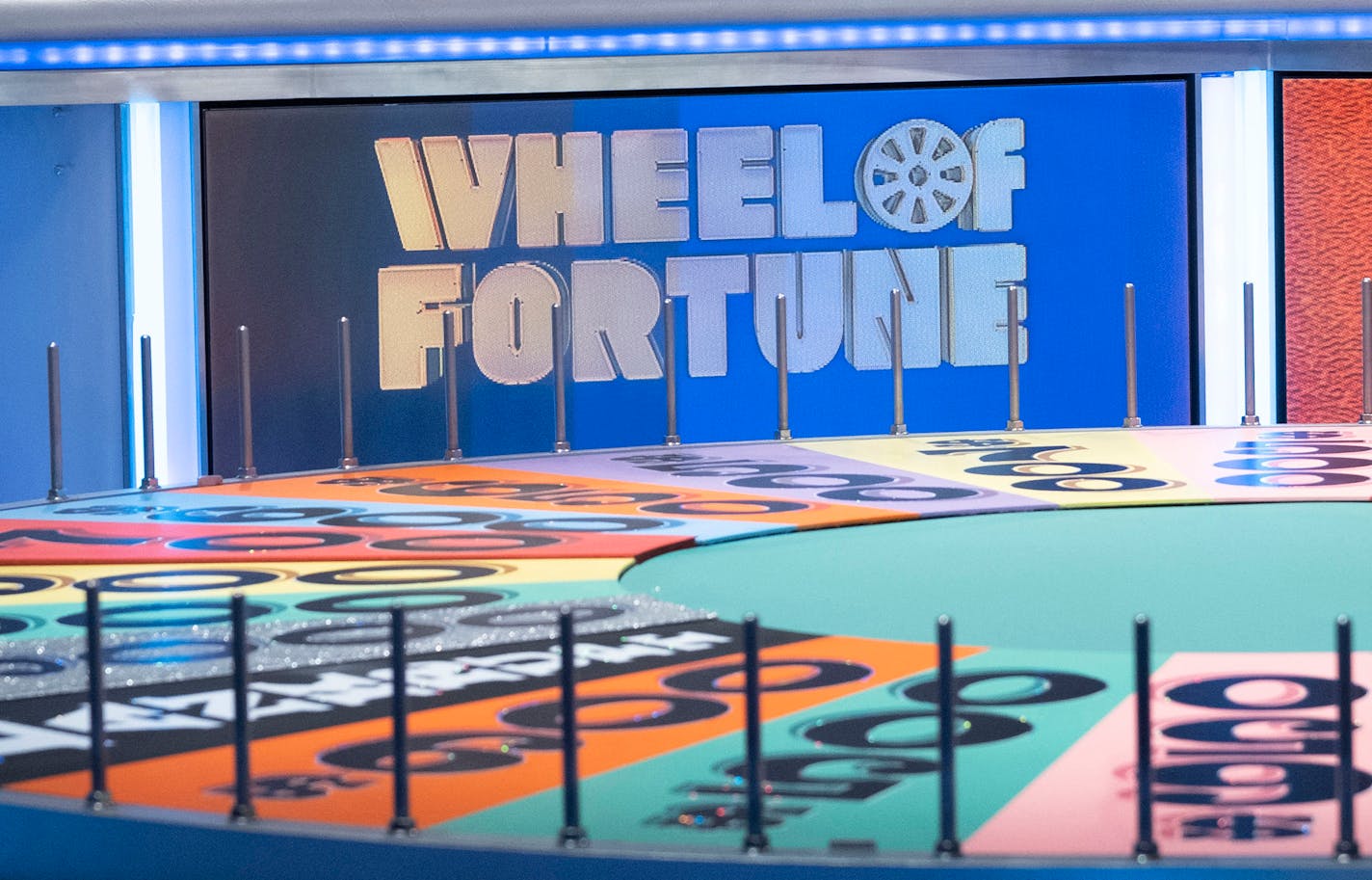 In an undated image provided by Carol Kaelson, Vanna White hosts "Wheel of Fortune." On Dec. 9, 2019, for the first time in 37 years, White stepped away from the big letter board and into the role of host, beginning a three-week stint leading the classic game show after Pat Sajak had emergency surgery. (Carol Kaelson via The New York Times) — NO SALES; FOR EDITORIAL USE ONLY WITH NYT STORY TV WHEEL WHITE BY MAYA SALAM FOR DEC. 9, 2019. ALL OTHER USE PROHIBITED. —