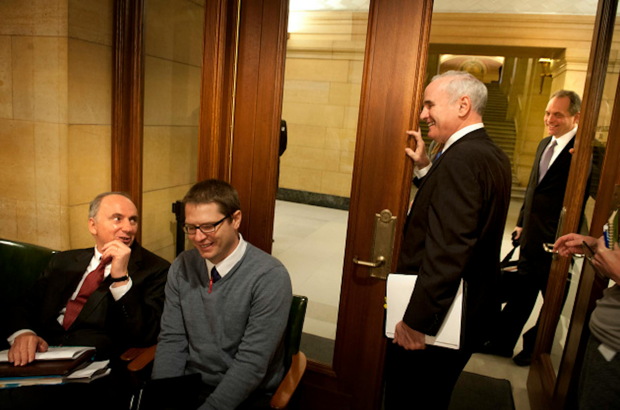 As As Commissioner Stinson held the door, Governor Dayton asked State Economist Dr. Tom Stinson, left, how he did speaking on the forecast.  Governor Mark Dayton spoke to reporters about the State of Minnesota February Budget Forecast on Thursday, February 28, 2013.    ]   GLEN STUBBE * gstubbe@startribune.com
