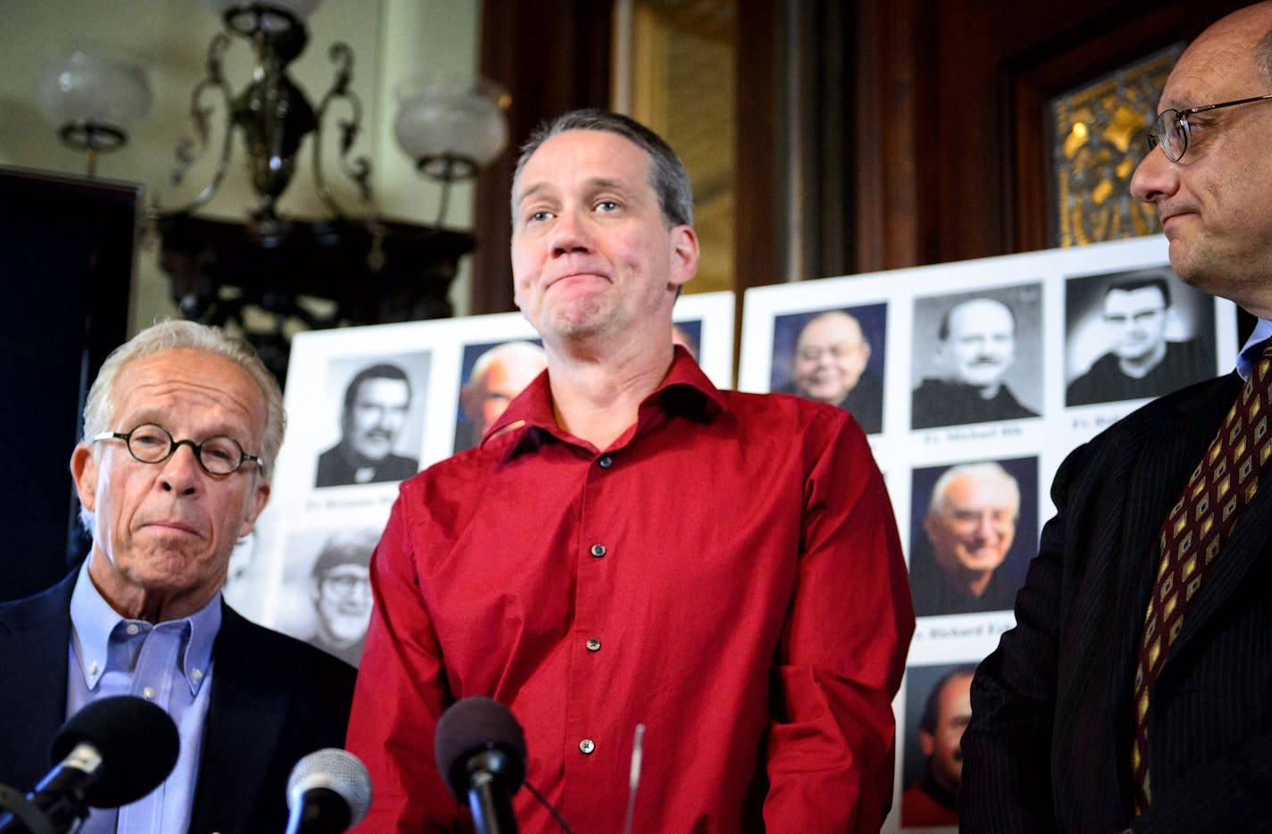 Troy Bramlage told his story of abuse by Fr. Allen Tarlton at St. John's Preparatory School in 1977. Attorney Jeff Anderson is on the left, attorney Mike Bryant on the right. ] GLEN STUBBE * gstubbe@startribune.com Tuesday, April 28, 2015 Attorney Jeff Anderson and his client Troy Bramlage announced a settlement of a civil lawsuit against St. John's Abbey and Fr. Allen Tarlton.