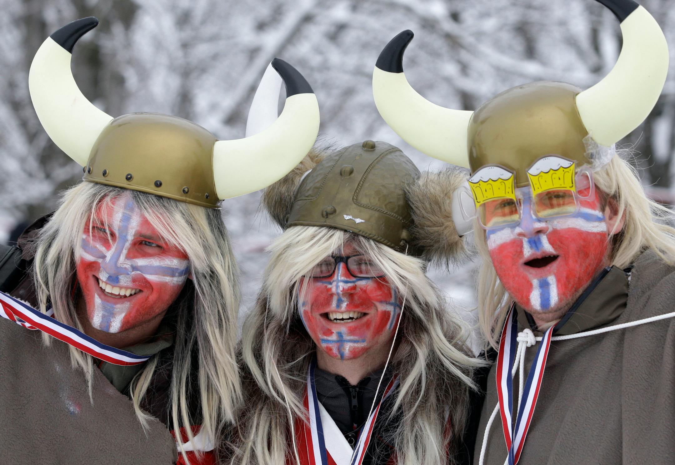 Spectators with the Norwegian flag celebrate a race at the Nordic World Ski Championships.