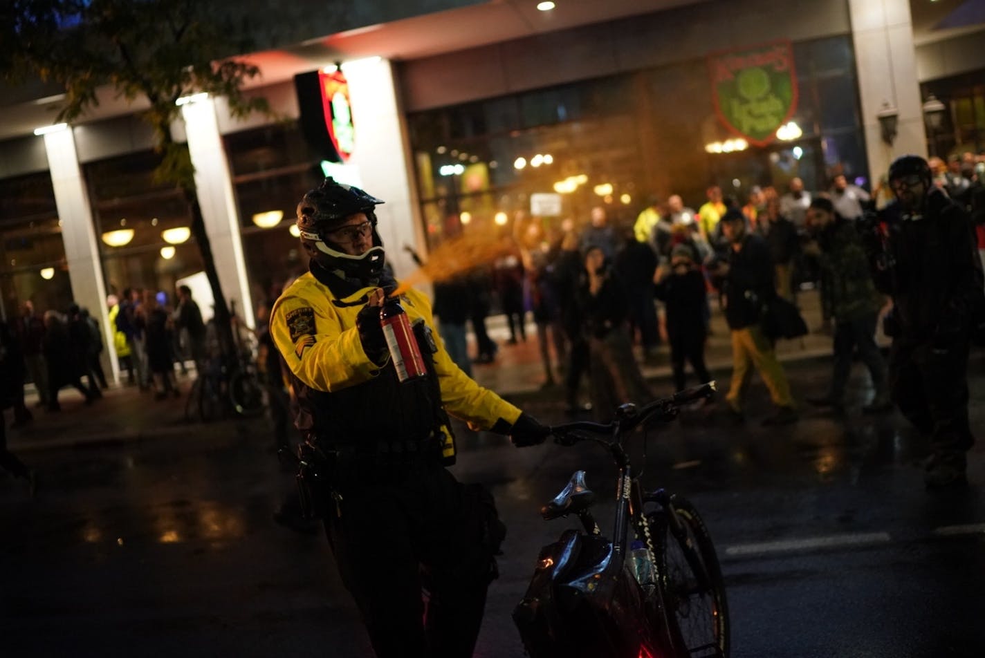 Police used pepper spray to disperse protesters Thursday night in downtown Minneapolis as President Donald Trump's campaign rally wrapped up.