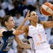 Phoenix Mercury's Diana Taurasi tries to keep the ball away from Minnesota Lynx's Lindsay Whalen during the first half in Game 1 of the WNBA Western C