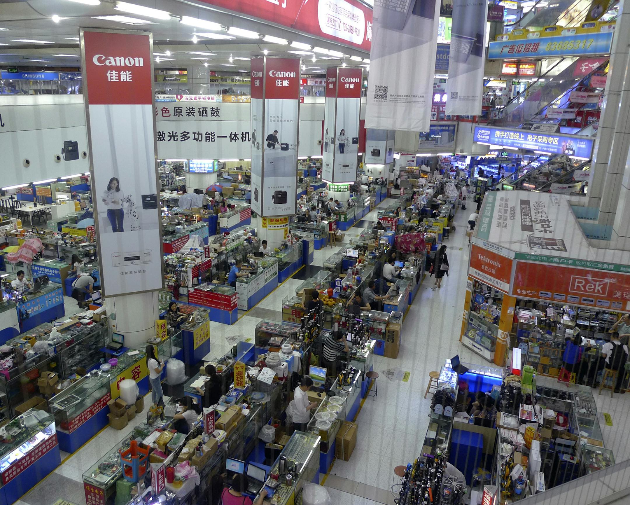 In this April 22, 2016 photo, buyers and vendors are seen at Shenzhen's Seg electronics market, a popular place for hardware startup entrepreneurs to buy components for their inventions and prototypes in Shenzhen, China. Once a collection of fishing enclaves next door to Hong Kong, Shenzhen has become the epicenter of Chinaís manufacturing-driven miracle is staking its future growth on finance, technology and culture. (AP Photo/Kelvin Chan) ORG XMIT: HK104