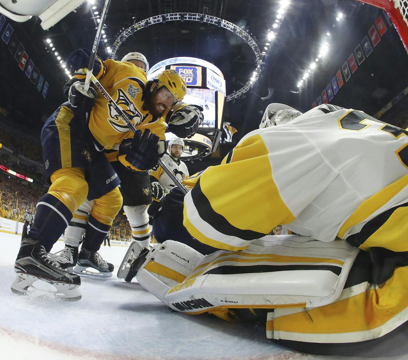 Pittsburgh Penguins goalie Matt Murray defends the goal against Nashville Predators' James Neal (18) during the first period of Game 6 of the NHL hockey Stanley Cup Final, Sunday, June 11, 2017, in Nashville, Tenn. (Bruce Bennett/Pool Photo via AP)