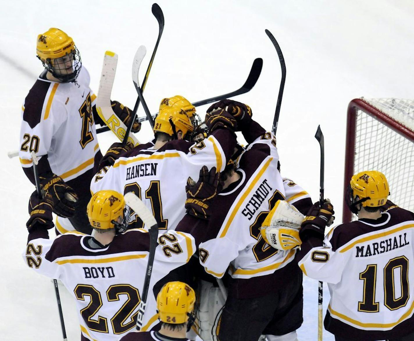 Minnesota players celebrate their 3-0 victory over Bemidji State in a college hockey game in Minneapolis, Friday, Feb. 17, 2012.