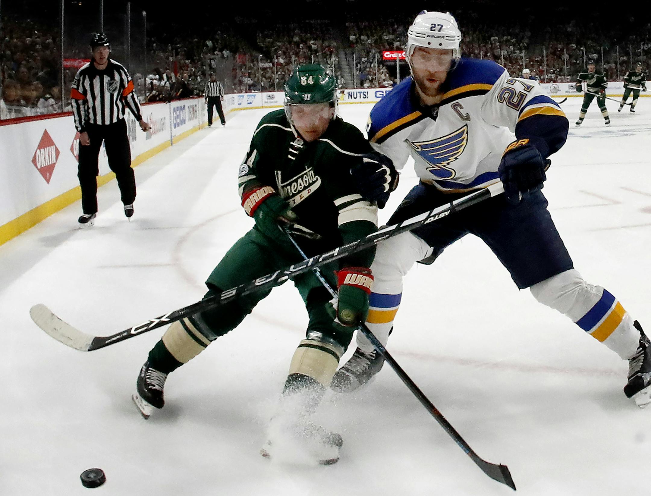 Mikael Granlund (64) and Alex Pietrangelo (27) fought for the puck in the first period. ] CARLOS GONZALEZ ï cgonzalez@startribune.com - April 14, 2017, St. Paul, MN, Xcel Energy Center, NHL, Stanley Cup Playoffs, Game 2, Minnesota Wild vs. St. Louis Blues