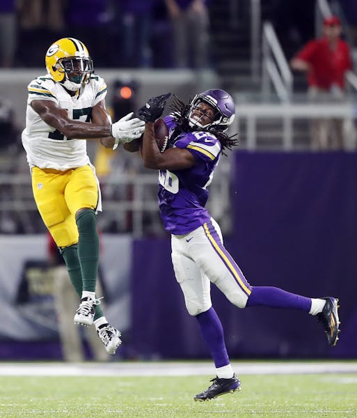 Minnesota Vikings cornerback Trae Waynes (26) intercepted a pass intended for Green Bay Packers wide receiver Davante Adams (17) late in the forth qua