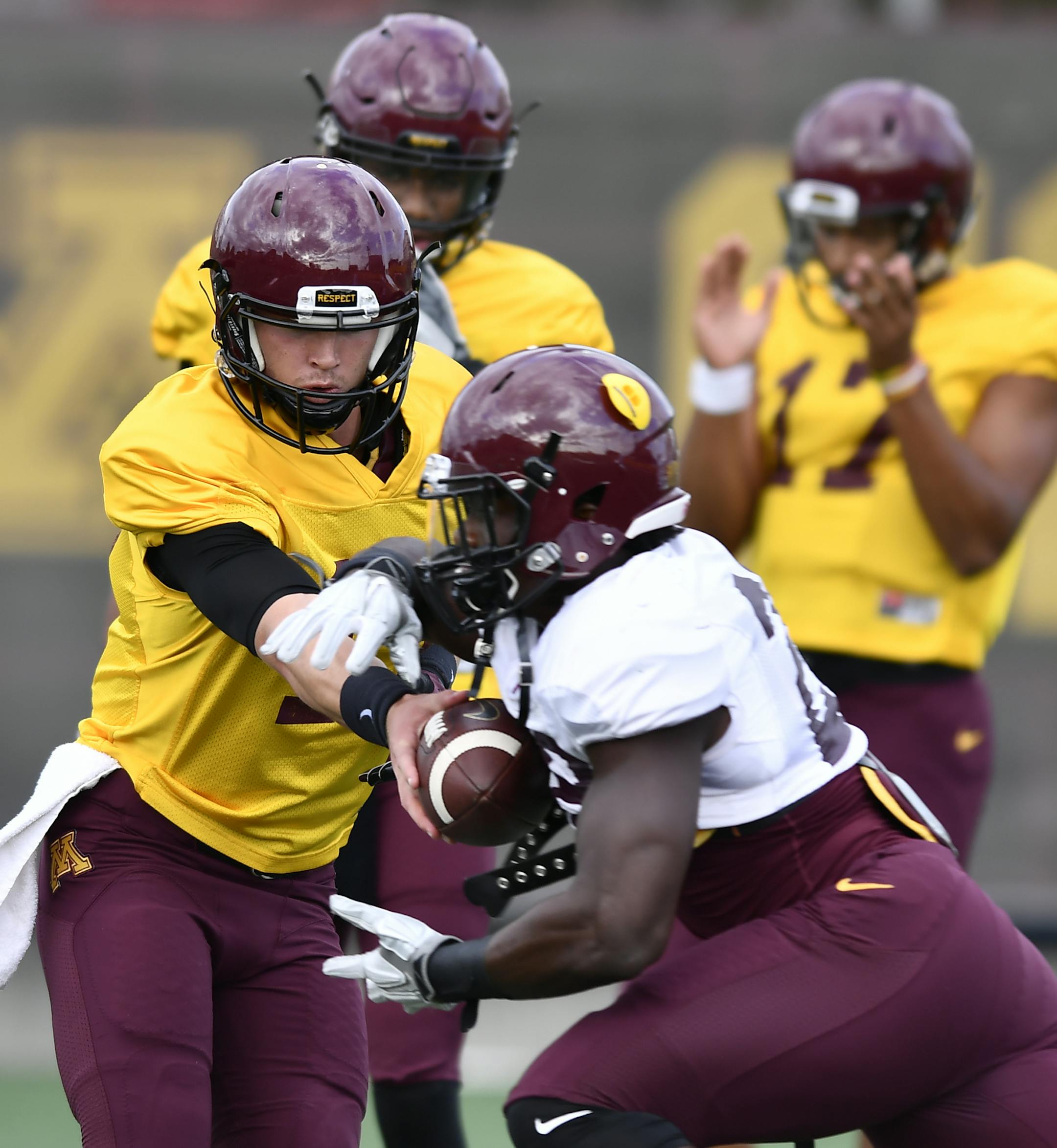 Gophers quarterback Conor Rhoda handed off the ball to running back Jonathan Femi-Cole during practice Tuesday afternoon. ] (AARON LAVINSKY/STAR TRIBUNE) aaron.lavinsky@startribune.com The Minnesota Wild played the Winnipeg Jets in their final preseason game on Saturday, Oct. 8, 2016 at Xcel Energy Center in St. Paul, Minn.