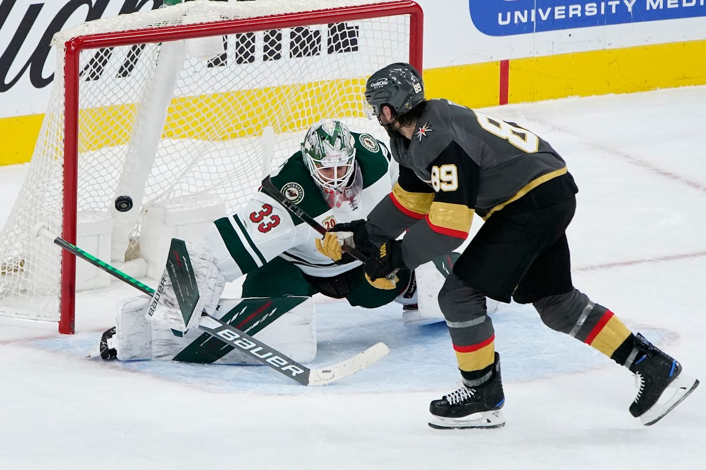 Vegas right wing Alex Tuch misses a shot on Wild goaltender Cam Talbot during Thursday night's shootout.