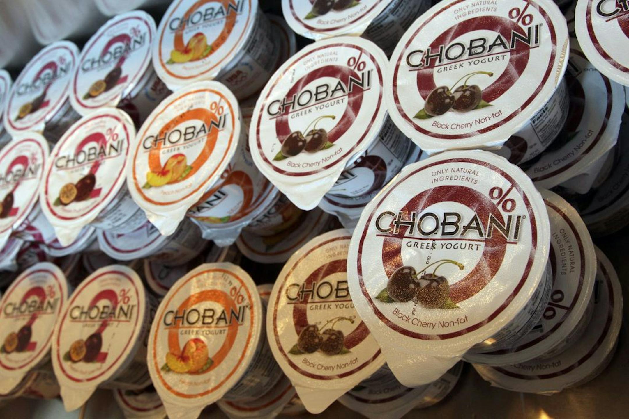 The 6-ounce containers of yogurt in various flavors are in display for sale at the Chobani yogurt bar in the Soho neighborhood of New York, Monday, July 23, 2012.