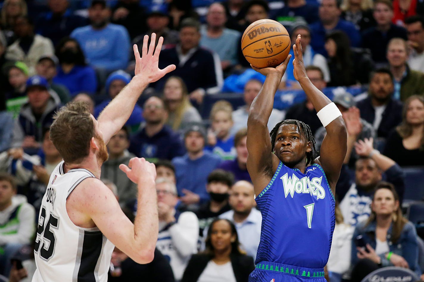 Timberwolves forward Anthony Edwards shoots on San Antonio center Jakob Poeltl in the second quarter