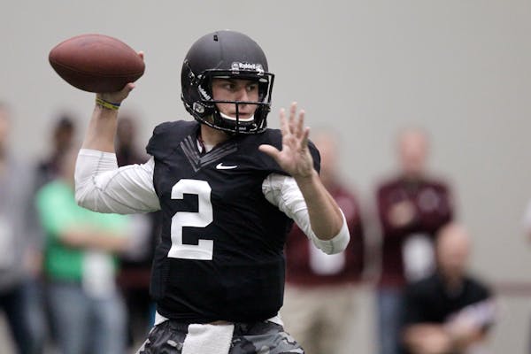 Texas A&M quarterback Johnny Manziel passes the ball during a drill at pro day for NFL football representatives in College Station, Texas, Thursday, M